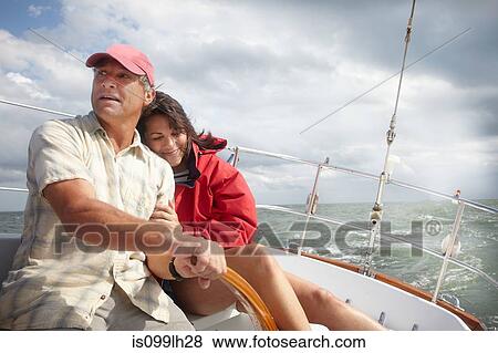 Mature couple sailing View Large Photo Image Stock Photo - Mature couple sailing. Fotosearch