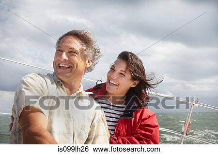Stock Photograph - Mature couple sailing. Fotosearch