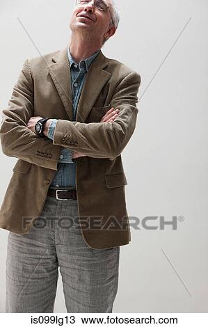 Mature man looking up and smiling, studio shot View Large Photo Image Stock Image - Mature man looking up and smiling, studio shot. Fotosearch