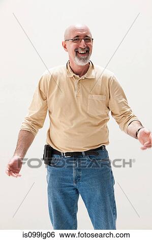 Mature man smiling, studio shot View Large Photo Image Stock Photograph - Mature man smiling, studio shot. Fotosearch
