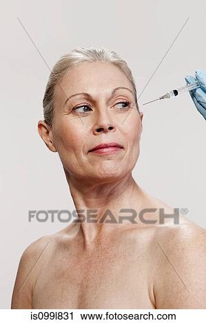 Mature woman receiving injections View Large Photo Image Stock Image - Mature woman receiving injections. Fotosearch