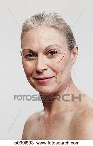 Mature woman with cosmetic surgery marking View Large Photo Image Stock Image - Mature woman with cosmetic surgery marking. Fotosearch
