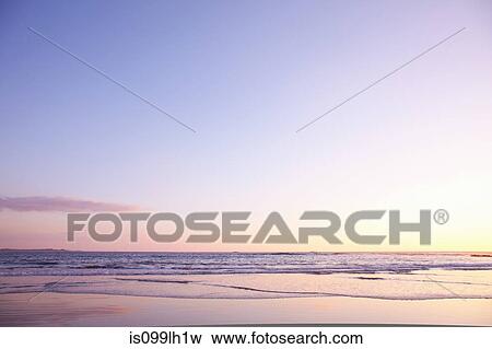 Stock Photo - Playa Grande beach at sunset, Santa Cruz, Costa Rica. Fotosearch