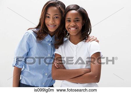 Portrait of African American sisters, studio shot View Large Photo Image Picture - Portrait of African American sisters, studio shot. Fotosearch