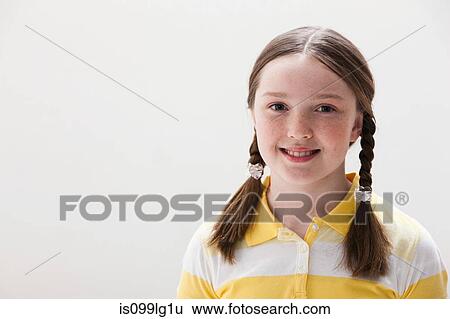 Portrait of girl smiling, studio shot View Large Photo Image Stock Photograph - Portrait of girl smiling, studio shot. Fotosearch