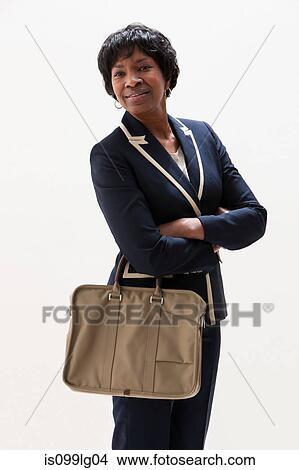 Portrait of mature African American businesswoman, studio shot View Large Photo Image Picture - Portrait of mature African American businesswoman, studio shot. Fotosearch