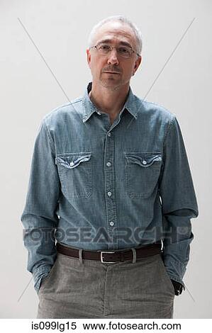 Stock Photography - Portrait of mature man, studio shot. Fotosearch