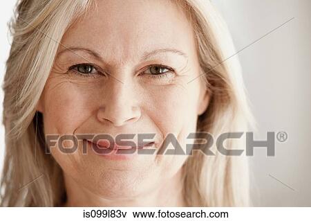Stock Photo - Portrait of mature woman, smiling. Fotosearch