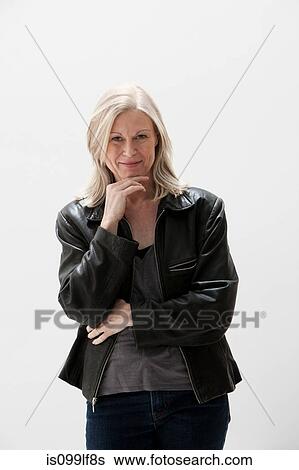 Portrait of mature woman, studio shot View Large Photo Image Stock Photograph - Portrait of mature woman, studio shot. Fotosearch