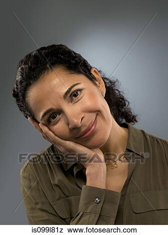 Portrait of mid adult woman, studio shot View Large Photo Image Stock Photo - Portrait of mid adult woman, studio shot. Fotosearch