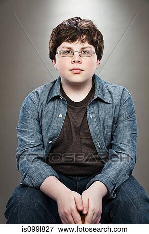 Portrait of young teenage boy wearing spectacles View Large Photo Image Stock Photo - Portrait of young teenage boy wearing spectacles. Fotosearch