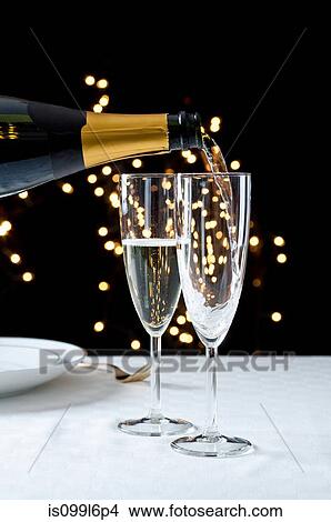 Picture - Pouring glasses of champagne. Fotosearch