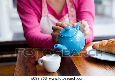 Pouring tea View Large Photo Image Stock Image - Pouring tea. Fotosearch