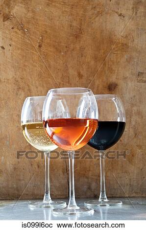Stock Image - Rose, white and red wines in glasses. Fotosearch