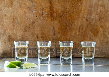 Row of tequila shots View Large Photo Image Stock Image - Row of tequila shots. Fotosearch