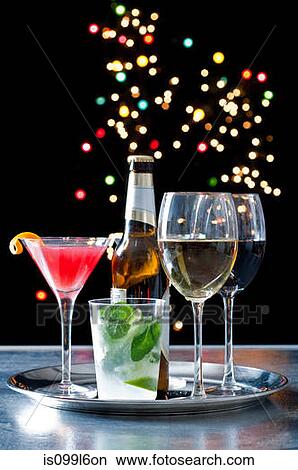 Selection of alcoholic drinks on a tray View Large Photo Image Picture - Selection of alcoholic drinks on a tray. Fotosearch