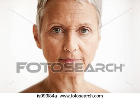 Senior woman against white background, portrait View Large Photo Image Stock Image - Senior woman against white background, portrait. Fotosearch
