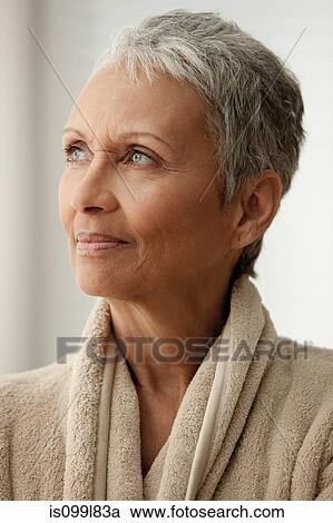 Stock Image - Senior woman in bathrobe. Fotosearch