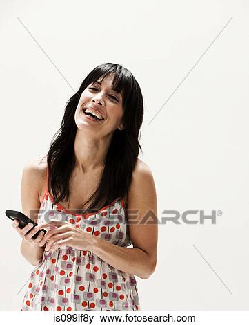 Smiling mature woman using cellphone, studio shot View Large Photo Image Stock Photo - Smiling mature woman using cellphone, studio shot. Fotosearch