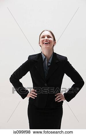 Young businesswoman laughing, studio shot View Large Photo Image Stock Photo - Young businesswoman laughing, studio shot. Fotosearch
