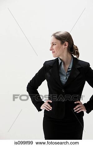 Young businesswoman looking away, studio shot View Large Photo Image Stock Photo - Young businesswoman looking away, studio shot. Fotosearch