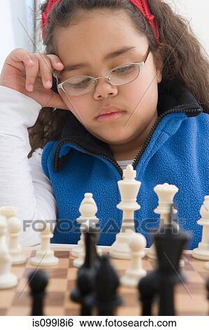 Young girl playing chess View Large Photo Image Stock Photograph - Young girl playing chess. Fotosearch