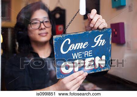 Young man opening shop View Large Photo Image Stock Image - Young man opening shop. Fotosearch