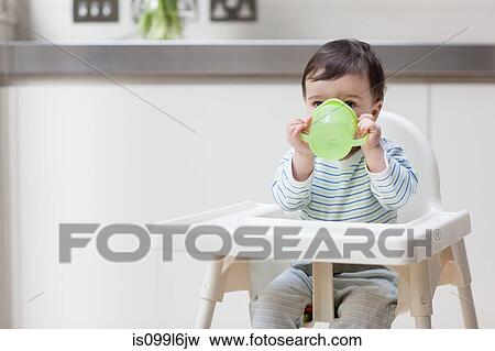 Stock Photo - Baby boy drinking. Fotosearch