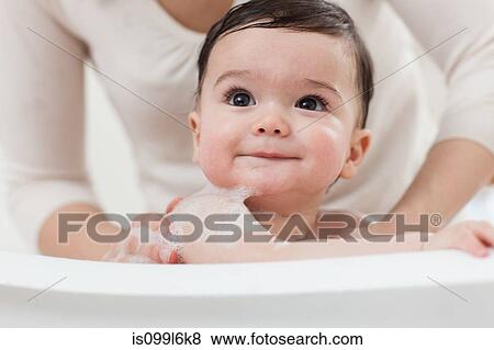 Baby boy having a bath View Large Photo Image Stock Photo - Baby boy having a bath. Fotosearch