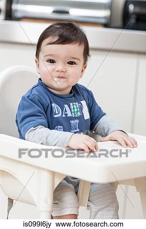 Stock Photo - Baby boy smiling with messy mouth. Fotosearch