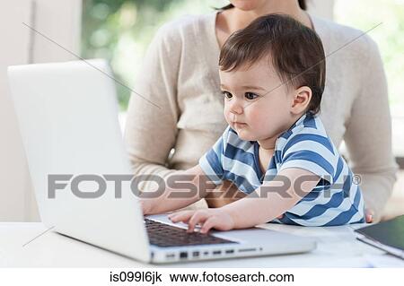 Baby boy using laptop View Large Photo Image Stock Image - Baby boy using laptop. Fotosearch