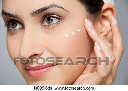 Beautiful woman with cream on her face View Large Photo Image Stock Photograph - Beautiful woman with cream on her face. Fotosearch