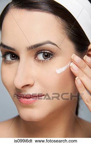 Beautiful woman with cream on her face View Large Photo Image Stock Photograph - Beautiful woman with cream on her face. Fotosearch