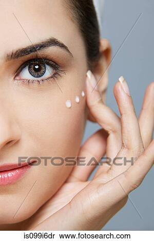Beautiful woman with cream on her face View Large Photo Image Stock Photography - Beautiful woman with cream on her face. Fotosearch