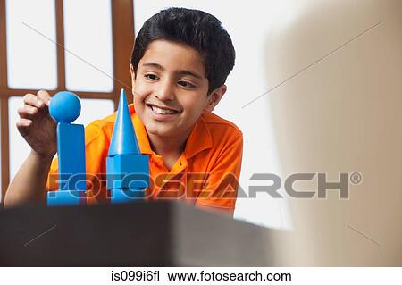 Boy playing with building blocks View Large Photo Image Stock Image - Boy playing with building blocks. Fotosearch