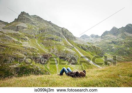 Boy resting, Alps, Tirol, Austria View Large Photo Image Picture - Boy resting, Alps, Tirol, Austria. Fotosearch