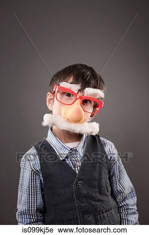 Boy wearing a funny face disguise View Large Photo Image Stock Image - Boy wearing a funny face disguise. Fotosearch