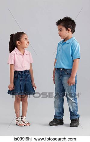 Brother and sister looking at each other View Large Photo Image Stock Image - Brother and sister looking at each other. Fotosearch