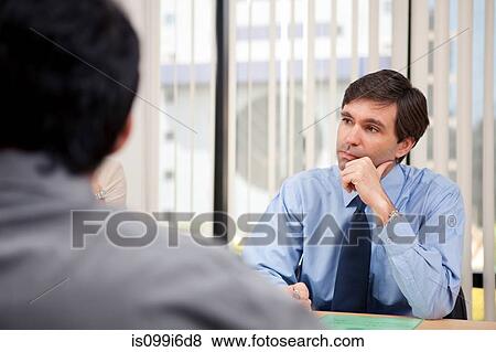 Business executive listening in a meeting View Large Photo Image Stock Photo - Business executive listening in a meeting. Fotosearch