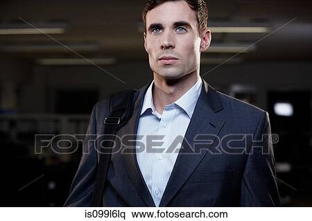 Businessman leaving office in the dark View Large Photo Image Stock Photography - Businessman leaving office in the dark. Fotosearch