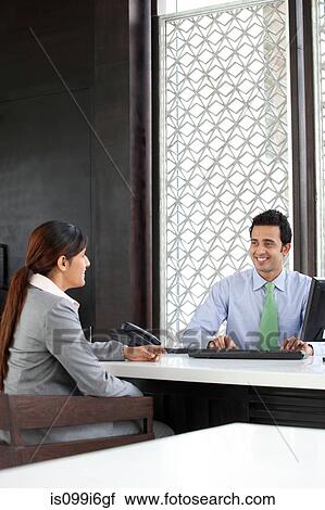 Businesswoman and executive talking View Large Photo Image Stock Image - Businesswoman and executive talking. Fotosearch