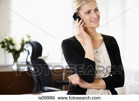 Businesswoman on cellphone View Large Photo Image Stock Image - Businesswoman on cellphone. Fotosearch