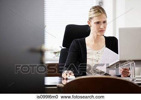 Businesswoman working in office View Large Photo Image Stock Image - Businesswoman working in office. Fotosearch