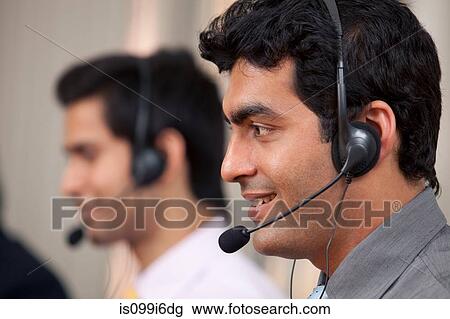 Call center agent smiling View Large Photo Image Stock Image - Call center agent smiling. Fotosearch