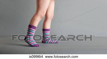 Child wearing striped socks View Large Photo Image Picture - Child wearing striped socks. Fotosearch