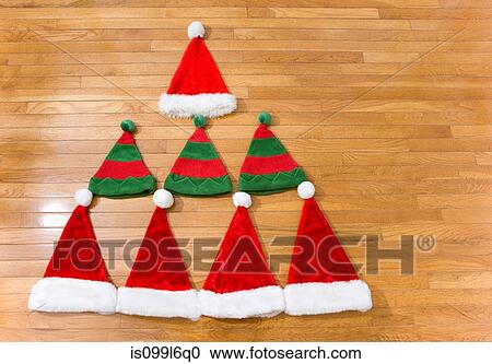 Christmas hats in shape of christmas tree View Large Photo Image Stock Image - Christmas hats in shape of christmas tree. Fotosearch
