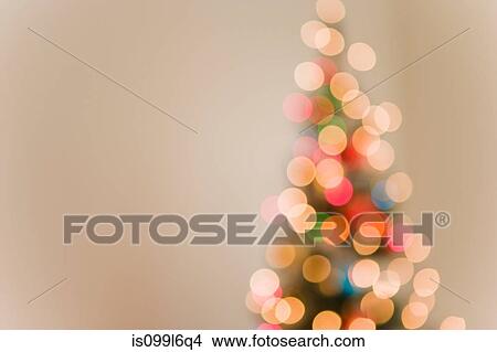 Picture - Christmas lights on tree, out of focus. Fotosearch