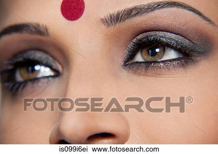 Close-up of a beautiful woman with a bindi View Large Photo Image Stock Image - Close-up of a beautiful woman with a bindi. Fotosearch