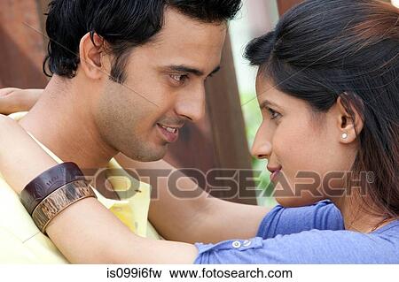 Stock Photo - Couple looking into each others eyes. Fotosearch