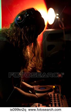 DJ performing in nightclub View Large Photo Image Stock Photography - DJ performing in nightclub. Fotosearch